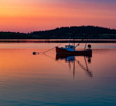 Still boat at sunset